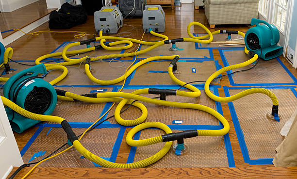 Professional Flood Damage Restoration technician working in Huntsville, AL